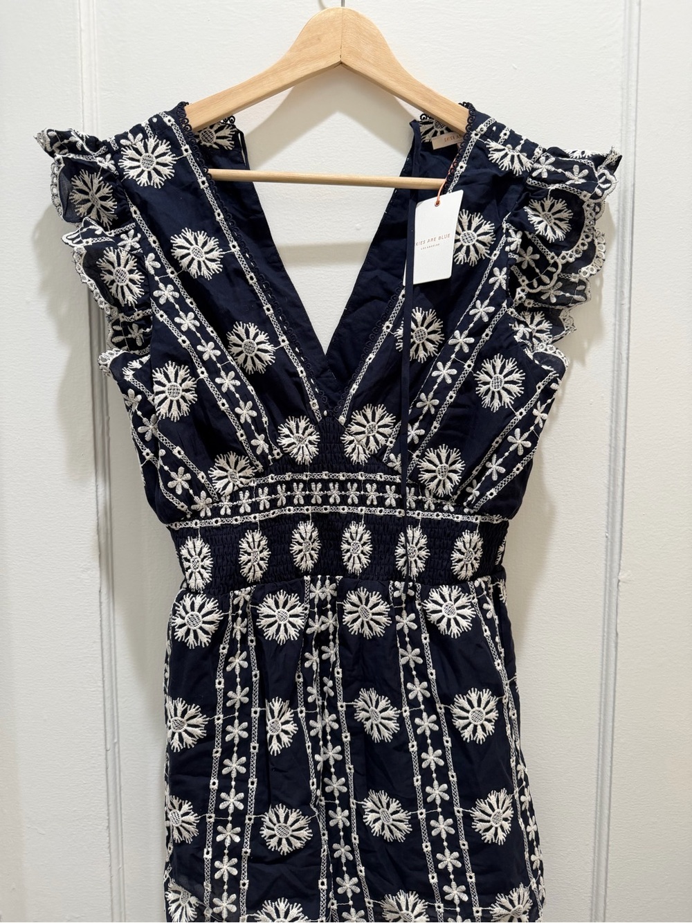 Skies Are Blue Navy Romper with White Floral Embroidery